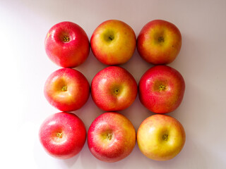 Appetizing ripe summer apples on a white background