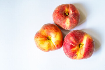 Sweet orange ripe fig peaches on the white background witch copy space