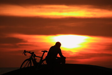 silhouette of a cyclist on a sunrise