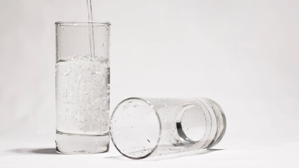 Pair of glasses on the floor water motion