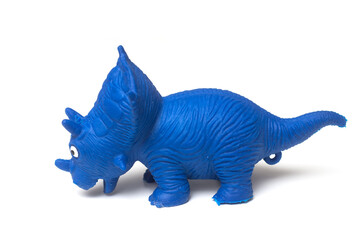 Closeup of blue plastic dinosaur toy on white background