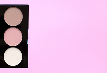Healthy vegan decorative cosmetic for make up close up on pink background. Eye shadow, highlighter, blush. Conscious consumption.