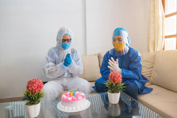 Friends with face masks celebrating birthdays during the Covid-19 virus quarantine.