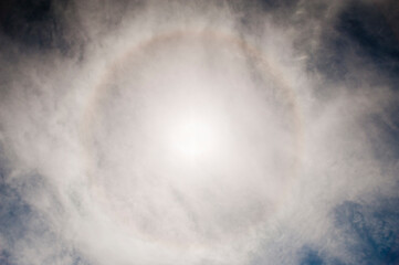 Halo Solar. Also known as a 22-degree halo or sun halo, the ring is caused by sunlight passing through ice crystals in the cirrus clouds within Earth's atmosphere,