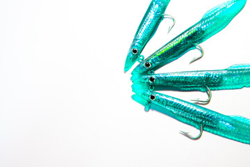 Shiny green fishing lures on a white background. Bass fishing.
