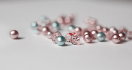 Beautiful glossy beads from pearls on white background