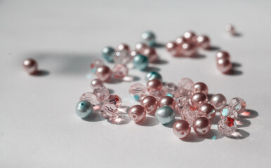 Beautiful glossy beads from pearls on white background
