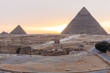 Fototapeta na wymiar The Sphinx, the Pyramid Of Khafre and the Pyramid of Menkaure in Giza at sunset, Egypt