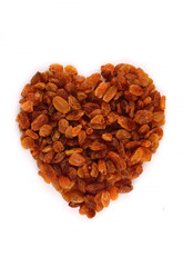 A scattering of organic raisins in the form of heart - isolated object