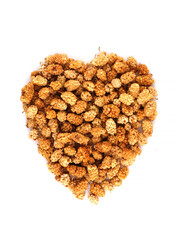 Organic dried Mulberry Placed in a heart shape isolated on white background.