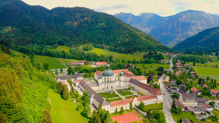 Ettal Abbey, called Kloster Ettal, a monastery in the village of Ettal, Bavaria, Germany - aerial...
