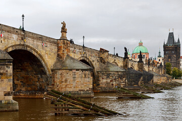 Charles Bridge, famous historic bridge that crosses Vltava river. Its construction started in 1357 under auspices of King Charles IV. Prague