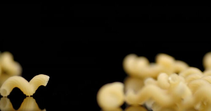 Cavatappi pasta dry falls on the table.