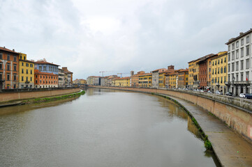Colorful houses in Pisa town both sides of the river