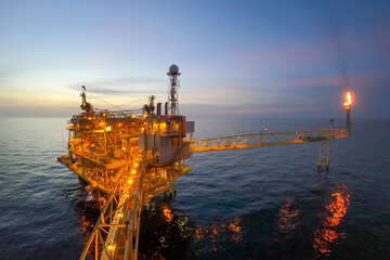 Offshore oil and gas or rig platform with beautiful sky in the evening time for oil and gas...