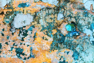 Colorful and rich texture of an old old wall at a suburban railway station with an interesting...