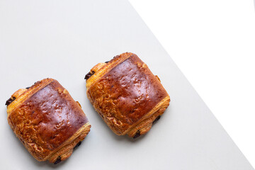 Homemade Chocolate Croissant on white marble.