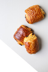 Homemade Chocolate Croissant on white marble.