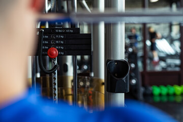 Weights in gym machine. Machines at the gym room.