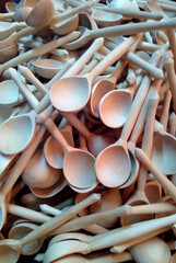 Yellow wooden spoons carved by hand. Russia