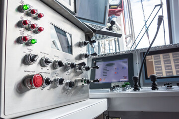 Oil rig computer controls & switches in operators room on rig floor. © chase clausen