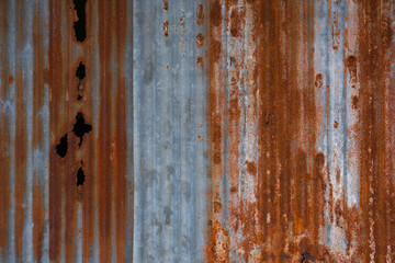 The tin roof background with the old rust and nails hole by vintage style.Galvanized iron steel plates with rust for background