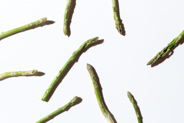 Green fresh asparagus on a gray background