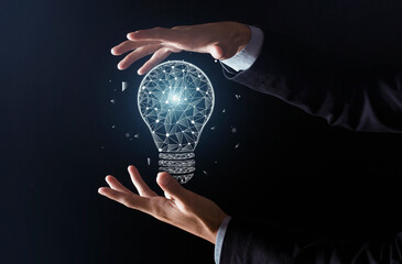 New ideas with innovation and creativity. Man hands do trick and glowing abstract light bulb appears