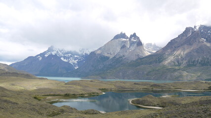 Aesthetic photography of the famous Argentine glacier, the Perito Moreno, with a unique composition and reflections of the high mountains of the Andes in the water