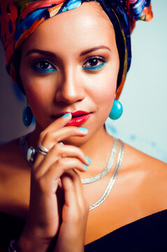 beauty bright african american woman with creative make up, shawl on head like cubian