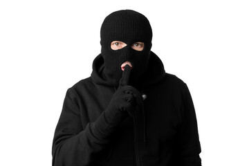Portrait of thief in black balaclava holding fingers on lip