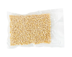 Pine nuts in transparent vacuum packaging isolated on white