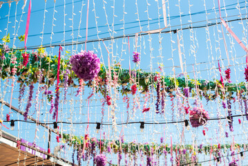 summer decoration for the street in carnival days. garlands, flowers, ribbons.