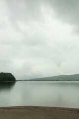 The lake in a cloudy day rain and reflections