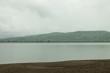 The lake in a cloudy day rain and reflections