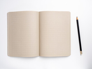 Blank open Notepad with pencil.