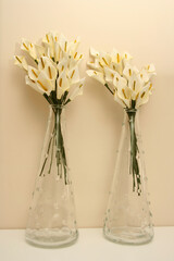 Cloth flowers inside a transparent glass jar