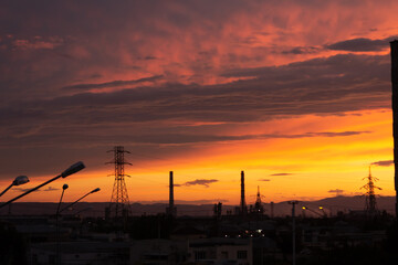 Fototapeta na wymiar Beautiful sky at sunset with towering towers, lanterns, houses