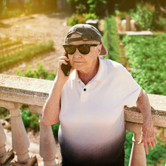 Elderly woman trying out her smartphone