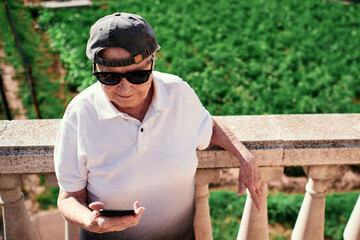 Elderly woman trying out her smartphone