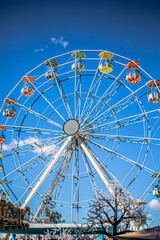 Fototapeta premium ferris wheel on a blue sky