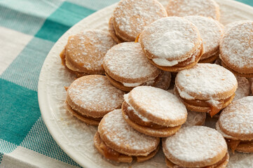 Alfajores: Traditional Peruvian cookies filled with caramel and white sugar dust on top.