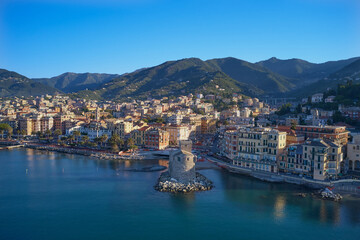 Fototapeta na wymiar Panoramic aerial view of the bay of the tourist city of Rapallo, Genoa, Italy. Resorts in Italy. The architecture of the ancient city. Aerial photography with drone. Rapallo Castle