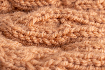 Wool hand knit pattern. Orange wool knitting texture background