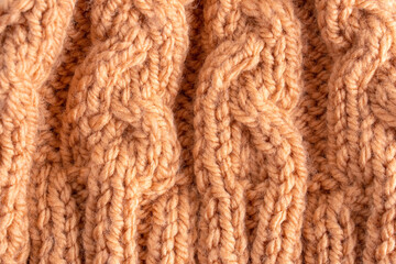 Wool hand knit pattern. Orange wool knitting texture background