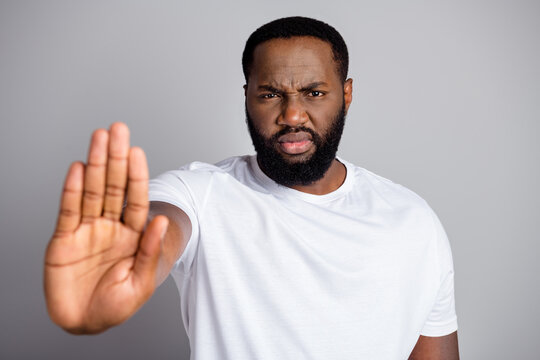 Photo Of Serious Dark Skin African Protester Member Community Against Black Citizens Lawlessness Raise Arm Stop Murder People Disenfranchised Concept Isolated Grey Color Background