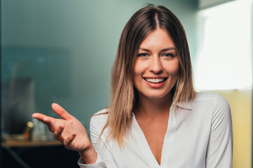 Cheerful beautiful caucasian girl student professional standing at home in office looking at camera, happy confident entrepreneur  laughing face posing alone, head shot close up view portrait. Webcam
