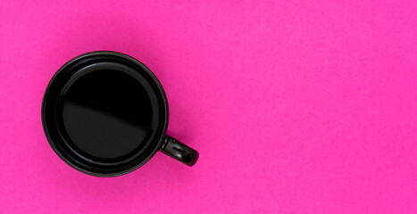 Top view, flat lay of black coffee cup on background pink.