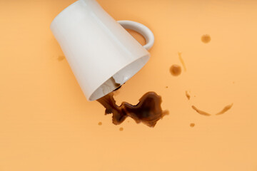 Fallen coffee cup with spilled coffee   flat lay  top view.