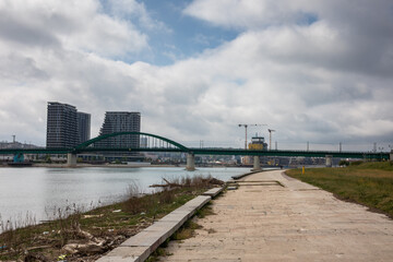 Old bridge on the Sava river near the construction area of Belgrade on the water in Belgrade capital of Serbia